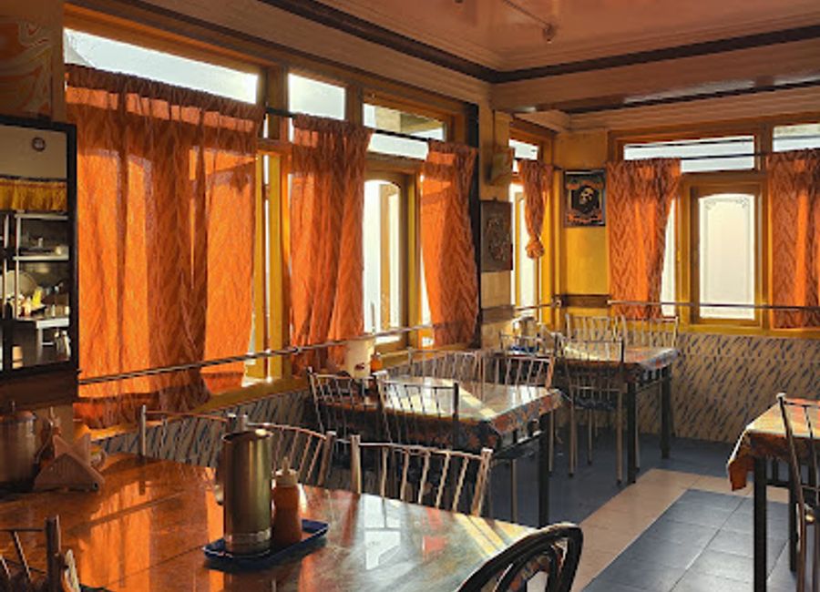 Experience delightful flavors at Blind Date Darjeeling - where local cuisine meets stunning mountain views in an inviting atmosphere.