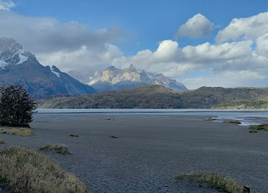 Experience authentic Patagonian cuisine at Rio Pingo, nestled in Torres del Paine National Park's breathtaking landscapes.