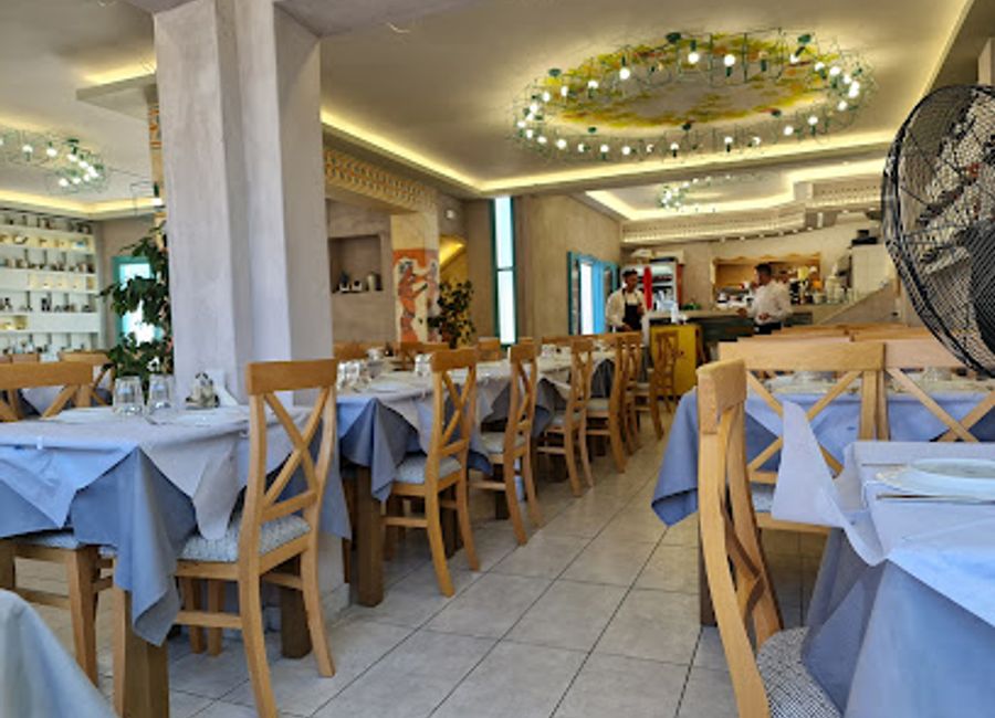 Experience authentic Greek flavors at Taverna El Greco in Fira - where culinary tradition meets stunning views.