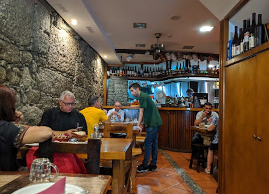 Discover the heart of Portugal at Taberna Trovador—where traditional flavors meet warm hospitality in Guimarães.