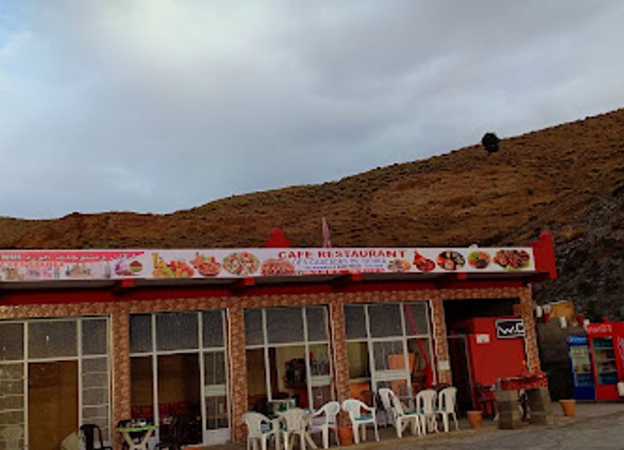 Experience authentic Moroccan cuisine at Café Restaurant Tichka amidst breathtaking Atlas Mountain views.