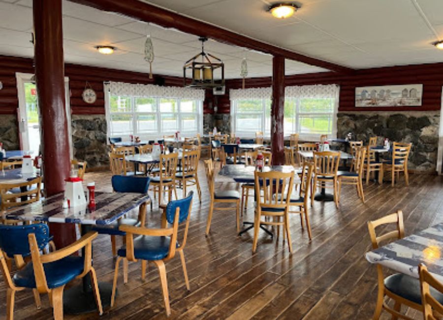 Experience fresh seafood and stunning views at Rusty Anchor Restaurant on Nova Scotia's scenic Cabot Trail.