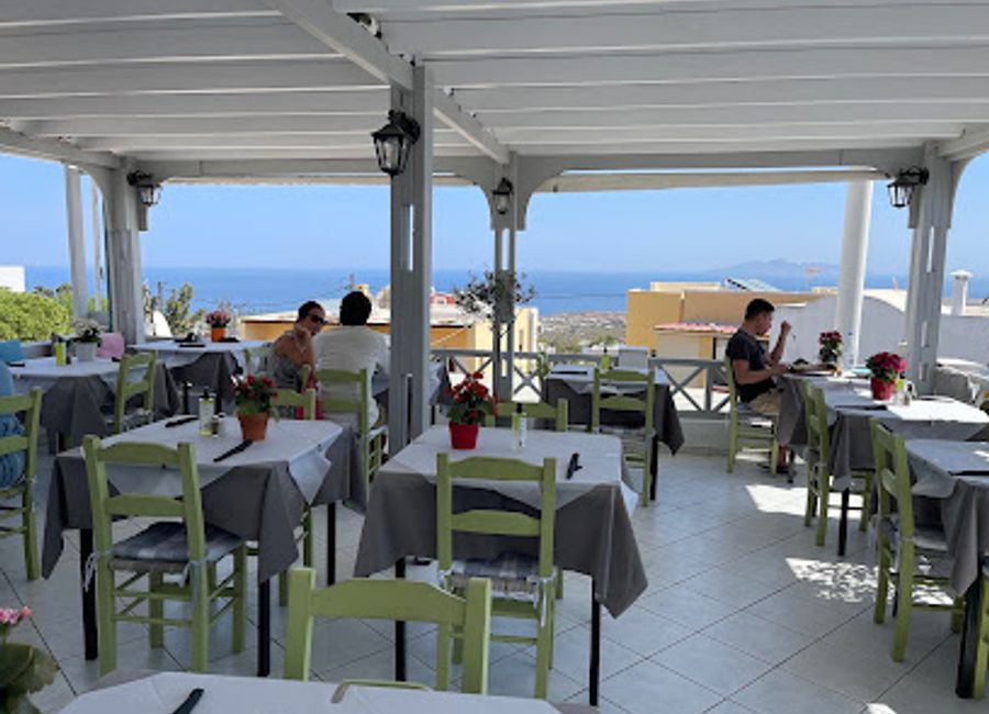 Experience authentic Mediterranean flavors at Triana Tavern in Fira - where Greek cuisine meets fresh seafood in a vibrant setting.