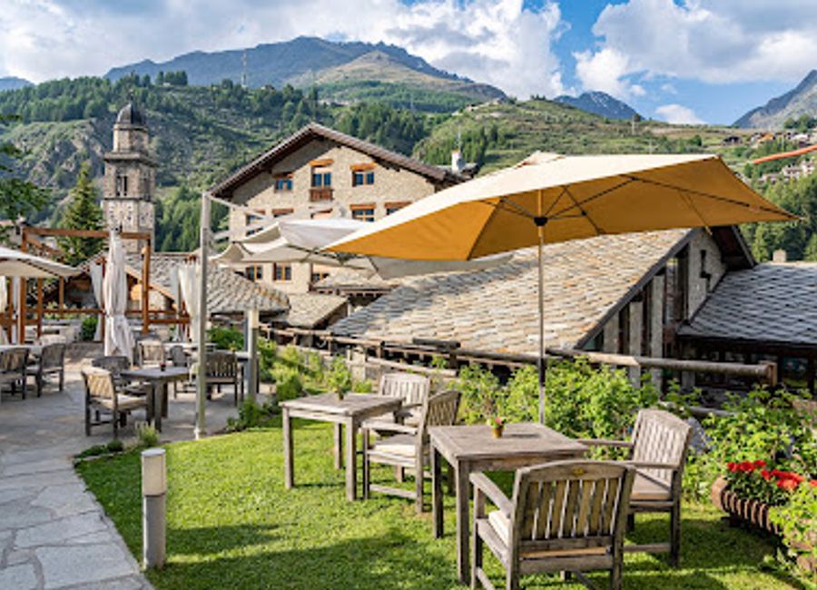 Experience authentic Italian cuisine paired with exquisite wines at La Cave de Cogne Osteria & Bottiglieria in picturesque Aosta Valley.