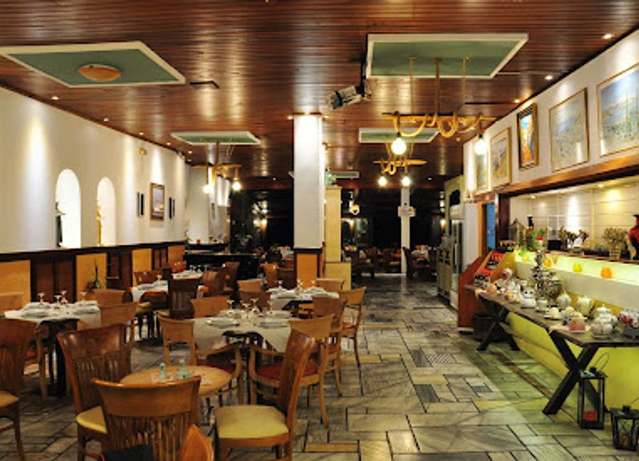 Discover authentic Greek flavors at Iniohos Taverna in Delphi - where tradition meets breathtaking views.