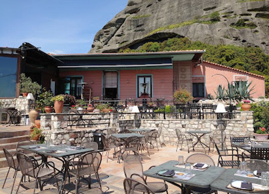 Discover authentic Greek flavors at Meteoron Panorama with breathtaking views over Meteora's majestic rock formations.