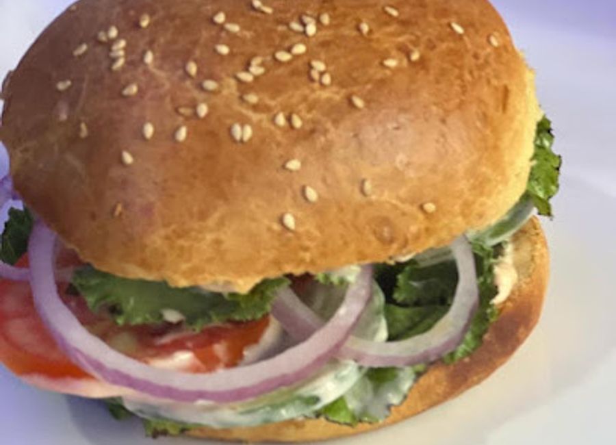 Savor delicious fast food at Famous Cafe Restaurant and Lounge in Ugi Majowel—where vibrant flavors meet a welcoming atmosphere.