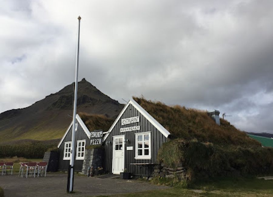 Discover culinary delights at Arnarbær in beautiful Arnarstapi, where local flavors meet stunning coastal views.