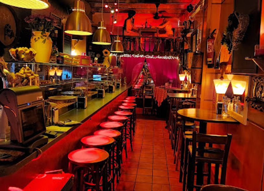 Experience authentic Spanish cuisine at Bodega Oliva - a vibrant tapas bar in the heart of Barcelona's historic Ciutat Vella.