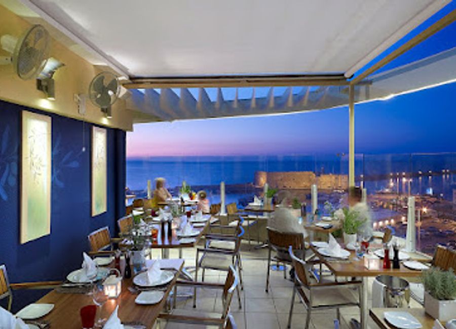 Experience exquisite Mediterranean cuisine with stunning views at Herbs' Garden in Heraklion.