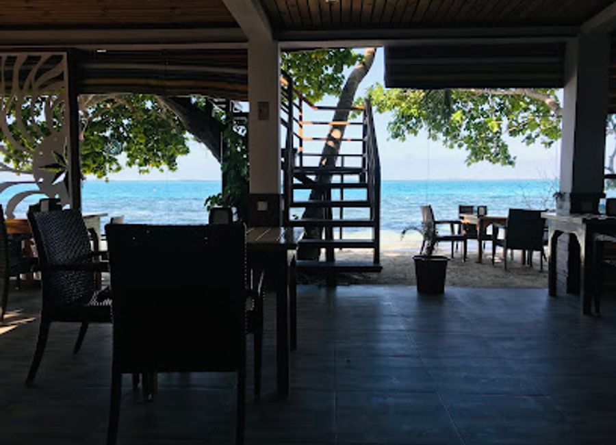 Experience exquisite dining with breathtaking ocean views at Compass Beach & Bistro in Dhangethi.