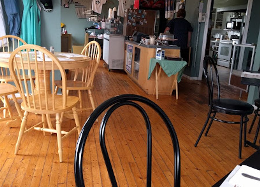 Experience local flavors amidst breathtaking views at Back Cove Café in Gros Morne National Park.