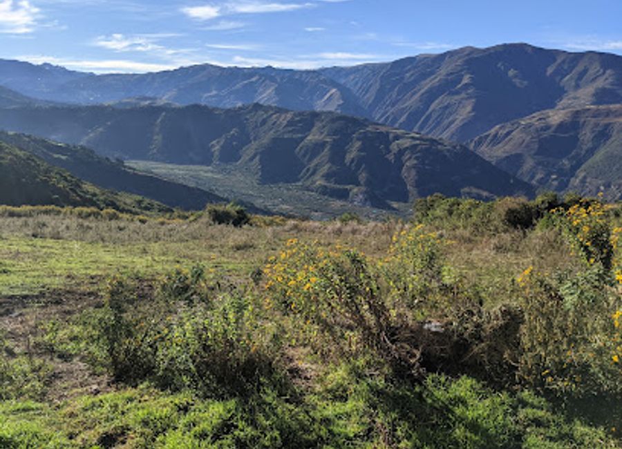 Experience authentic Peruvian breakfast at Restaurant Turístico El Encanto Salkantay amidst breathtaking mountain views.