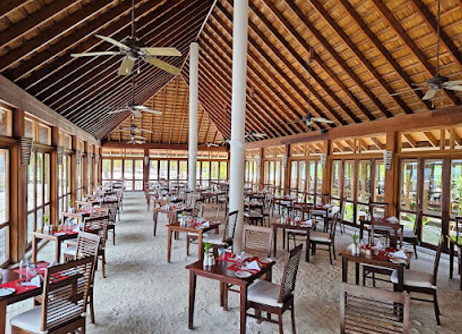 Experience an unforgettable culinary journey at Vilamendhoo Ahima Buffet Restaurant with diverse dishes and stunning island views.