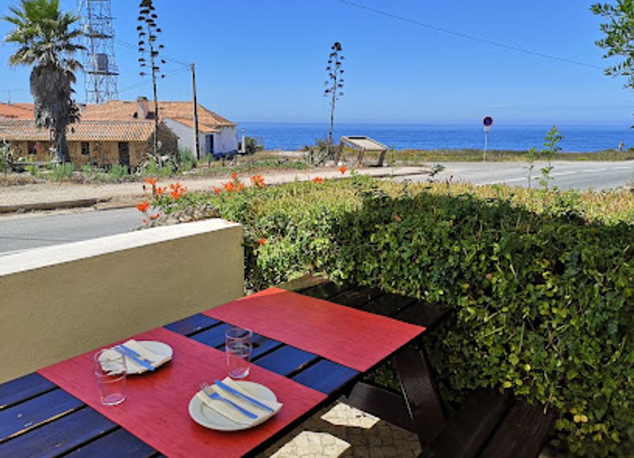 Discover authentic Portuguese flavors at A Barca Tranquitanas, a traditional restaurant in Zambujeira do Mar with stunning coastal views.