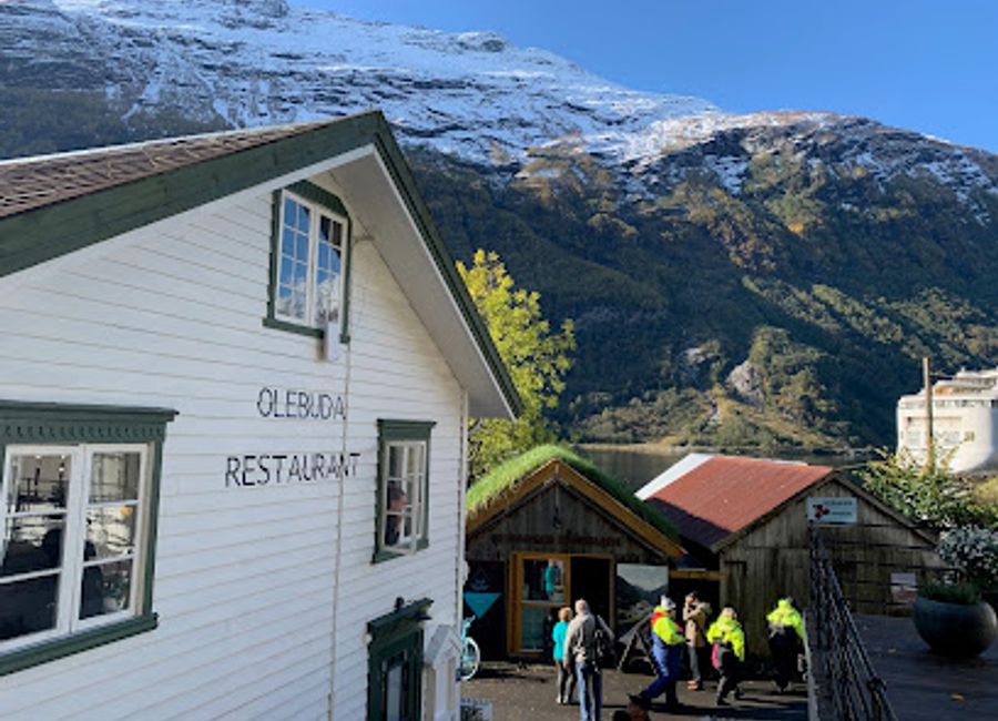 Experience authentic Norwegian cuisine with stunning fjord views at Restaurant Olebuda in Geiranger.