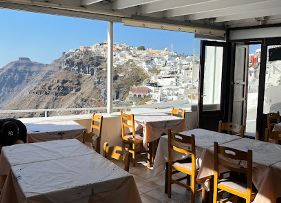 Experience authentic Greek cuisine at Naoussa, where tradition meets breathtaking views in beautiful Santorini.