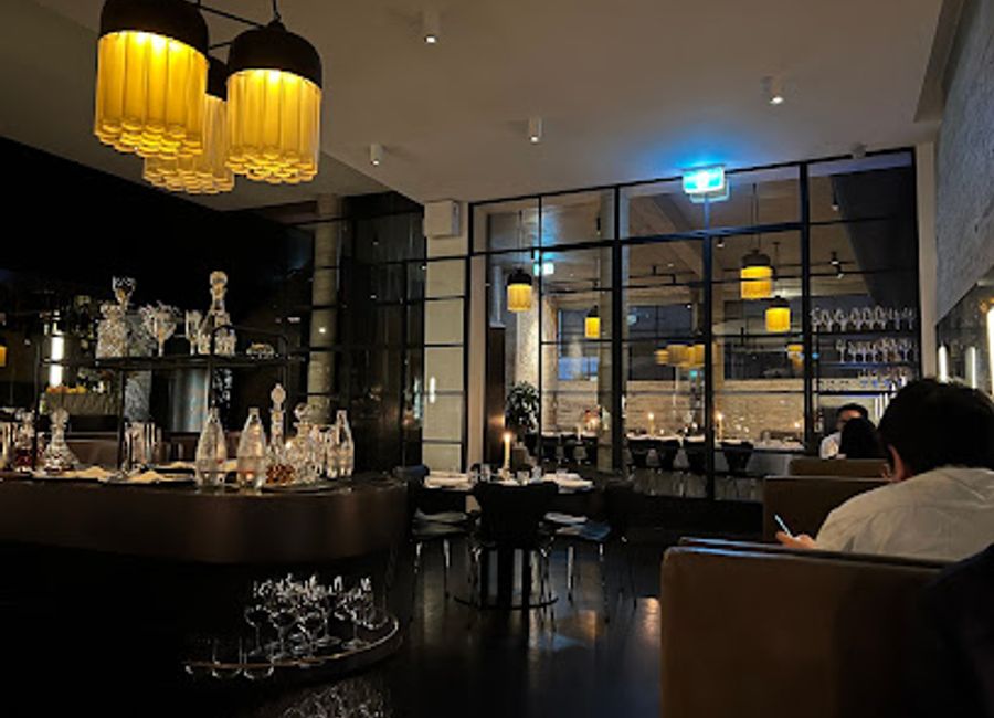 Experience contemporary Australian cuisine at Cutler & Co., where innovation meets tradition in an elegant setting.