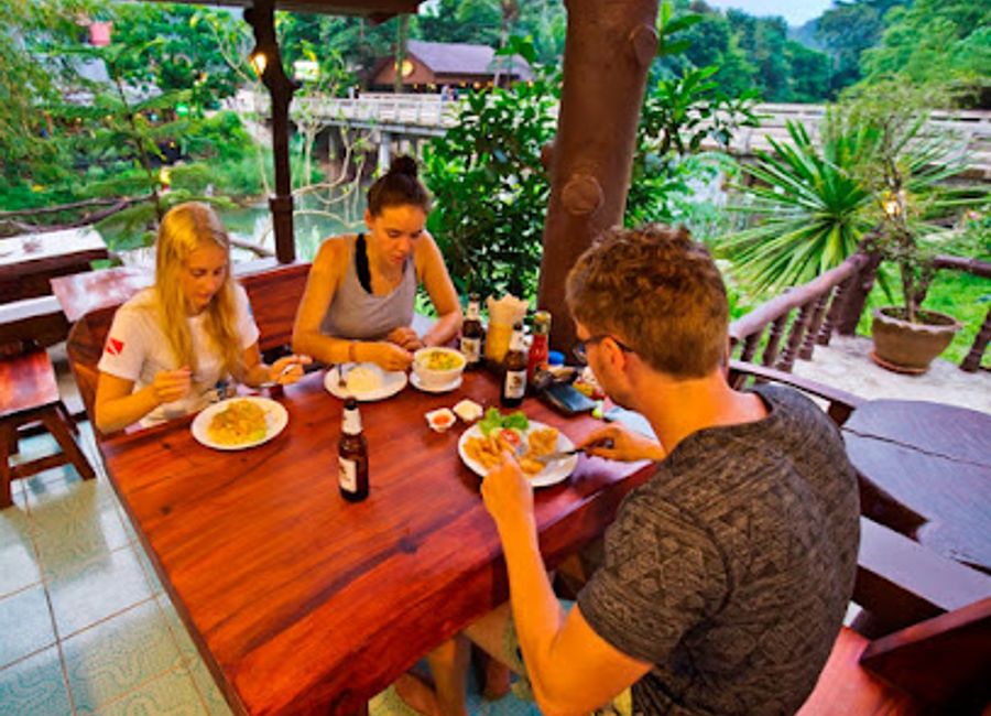 Discover Rafflesia Cafe: Your cozy retreat for authentic Thai flavors amidst Khlong Sok's stunning natural beauty.