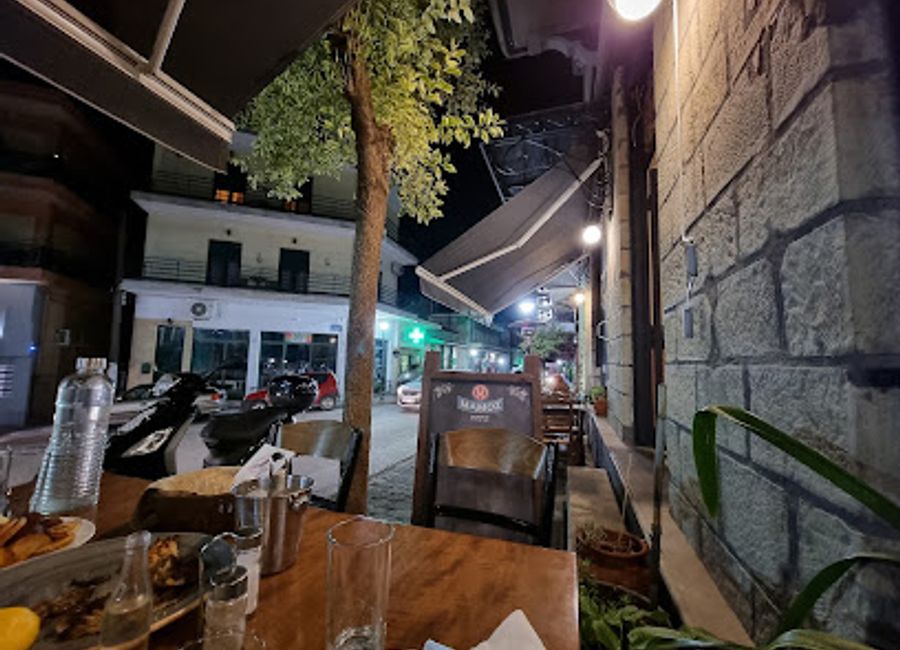 Experience authentic Greek flavors at Fortounis Tsipouradiko, a charming small plates restaurant in Kalampaka offering delightful meze and stunning views.