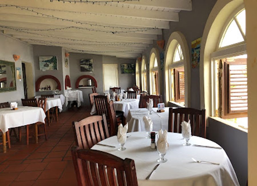 Experience exquisite dining with breathtaking ocean views at Round House in Bathsheba, Barbados – a perfect blend of cuisine and culture.