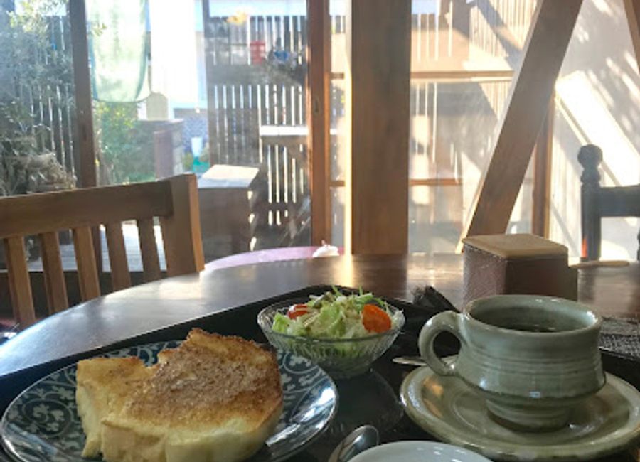 Discover Café Ippo in Naoshima: A delightful fusion of authentic Japanese cuisine and warm hospitality awaits you in this charming café.