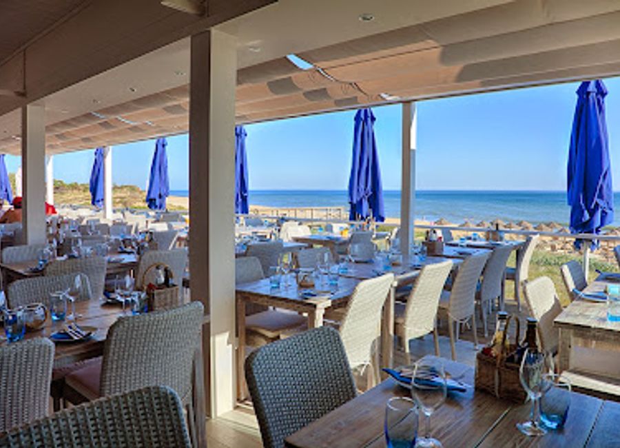 Experience authentic Portuguese flavors and breathtaking beach views at Maria's Restaurant in Algarve.