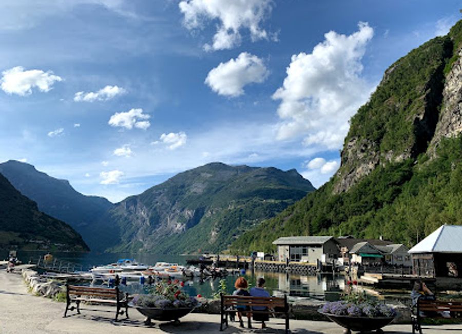 Experience authentic Norwegian cuisine amidst breathtaking fjord views at Låna Bistro in Geiranger.