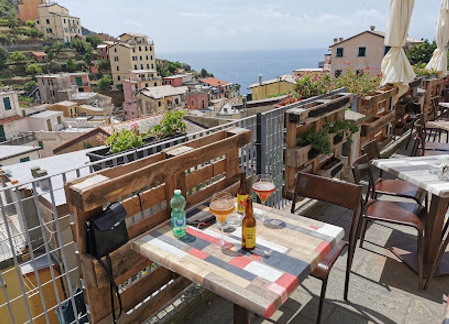Experience authentic Italian cuisine with breathtaking views at Fuori Rotta in Riomaggiore's stunning coastal landscape.