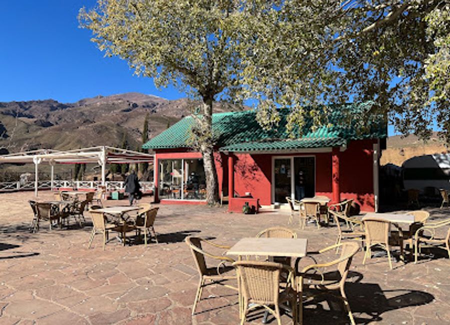 Experience authentic Moroccan cuisine at Café-Restaurant Assanfou with breathtaking views of the Atlas Mountains.
