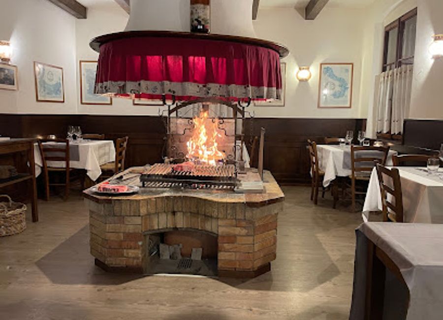 Savor authentic Italian cuisine and exceptional local wines at Antica Osteria Al Ponte in San Daniele del Friuli.