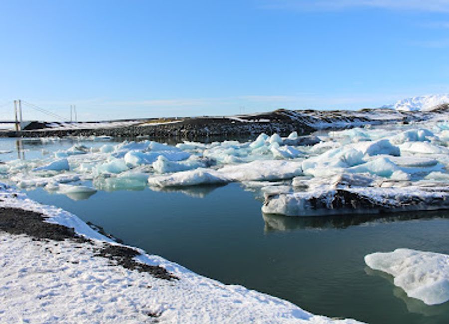 Discover breathtaking views at Jökulsárlón Viewpoint, where majestic icebergs float serenely in stunning glacial waters surrounded by Icelandic landscapes.