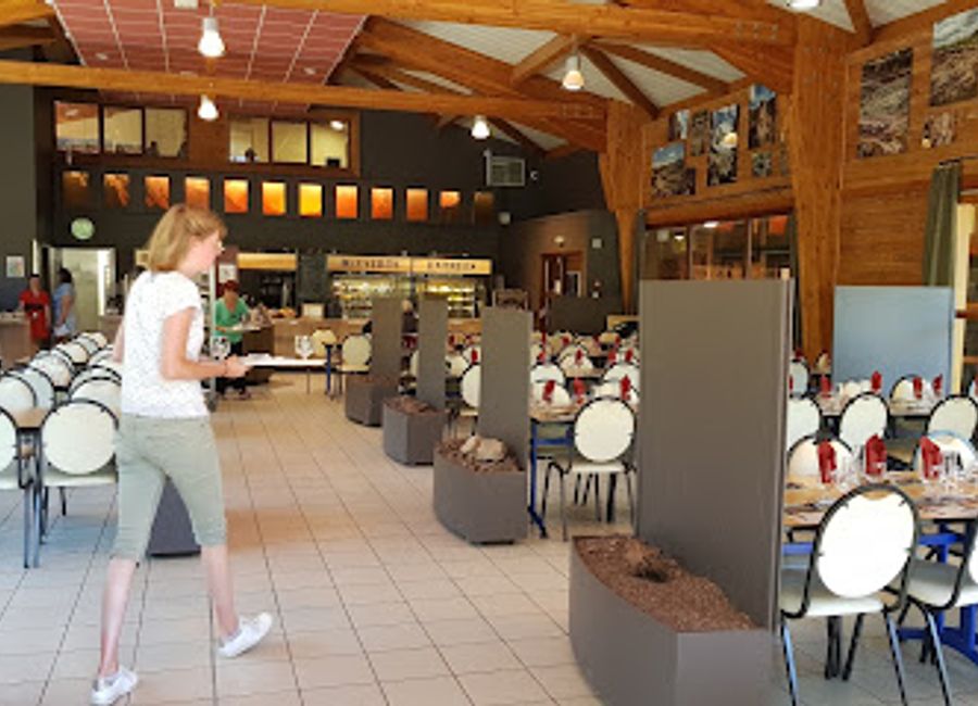 Experience authentic French cuisine amidst stunning volcanic landscapes at Restaurant du Volcan de Lemptégy.