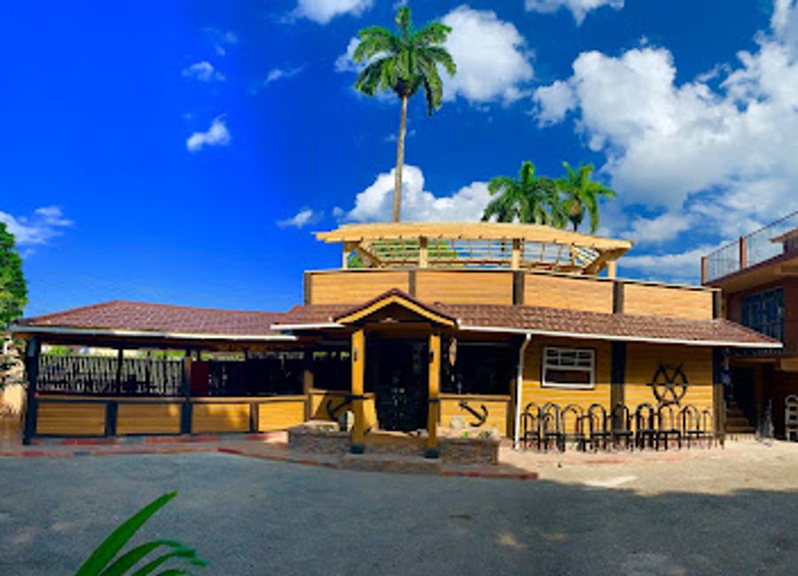 Discover authentic Jamaican flavors at Roots 21 Bar & Kitchen in Port Antonio – where culinary tradition meets vibrant atmosphere.