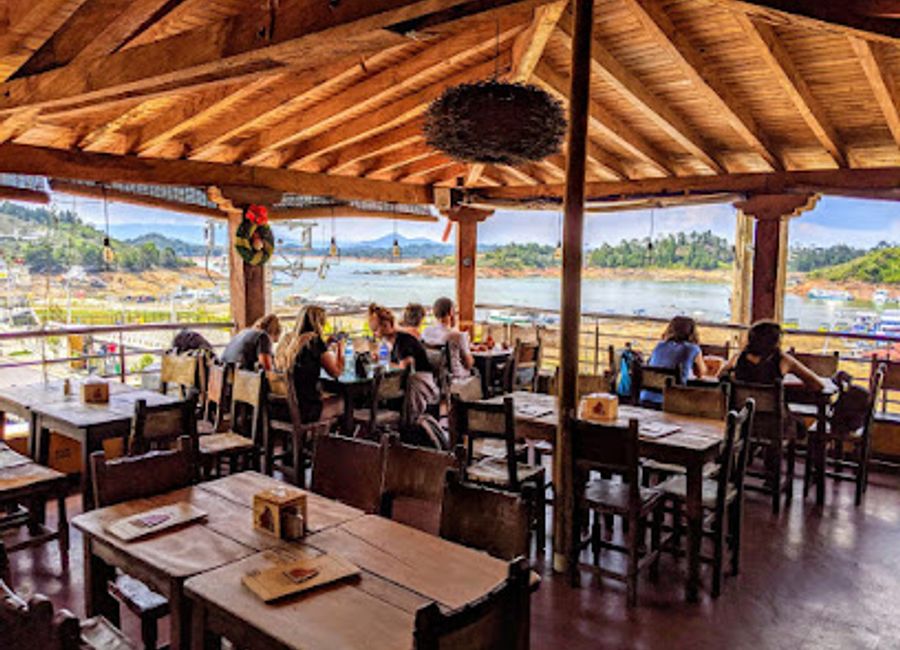 Experience the essence of Colombian cuisine at La Fogata in Guatapé - where grilled perfection meets vibrant atmosphere.