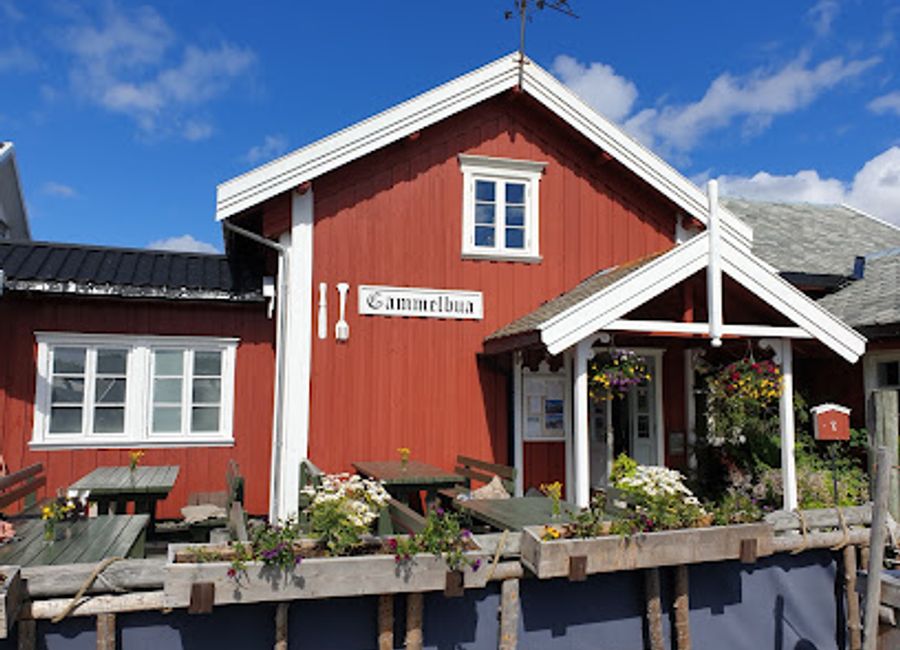 Discover exquisite Norwegian cuisine amidst breathtaking fjord views at Restaurant Gammelbua in Reine.
