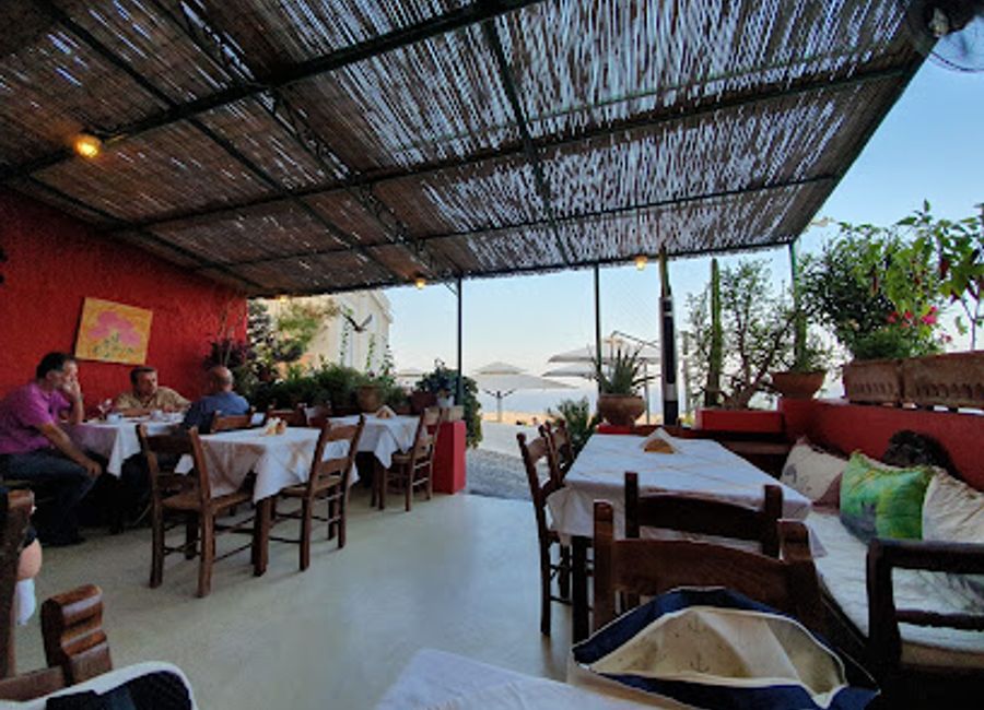 Experience authentic Greek cuisine with stunning views at Metaxi Mas in Exo Gonia, Santorini – a true culinary delight.