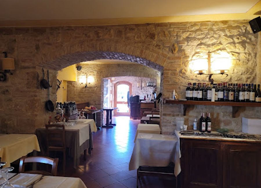 Experience authentic Tuscan cuisine at Ristorante da Pode in San Gimignano, where tradition meets flavor amidst stunning countryside views.