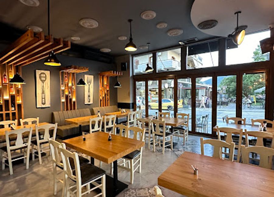 Experience authentic Greek cuisine at Ambrosia Taverna in Kalampaka, where delightful dishes meet stunning views of Meteora.