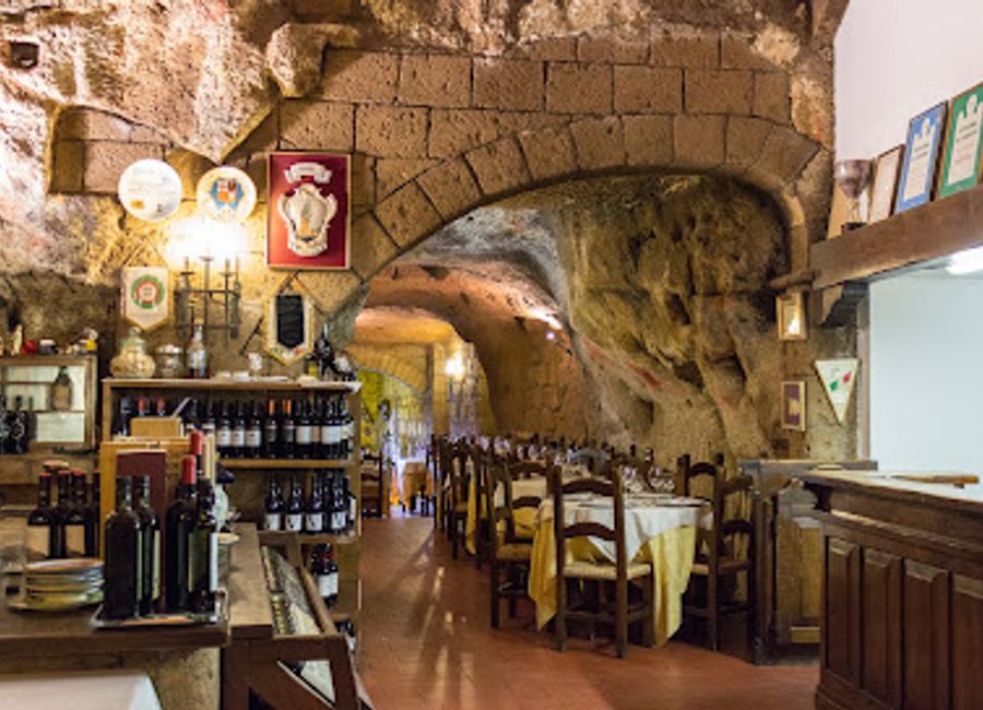 Experience authentic Italian cuisine with stunning views at Ristorante Grotte del Funaro in beautiful Orvieto.