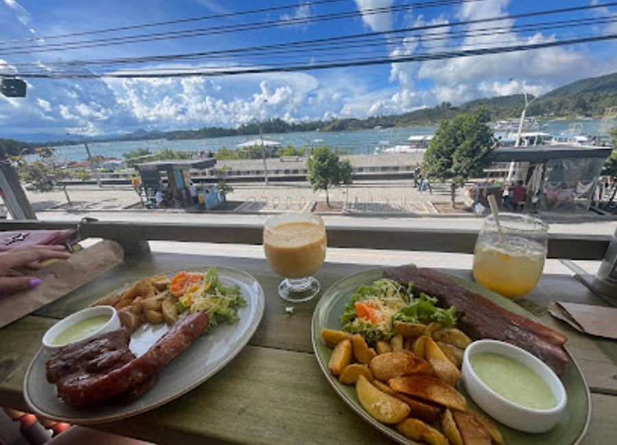 Experience authentic Colombian cuisine at Don Oscar in Guatapé, where local flavors meet stunning views for an unforgettable dining adventure.