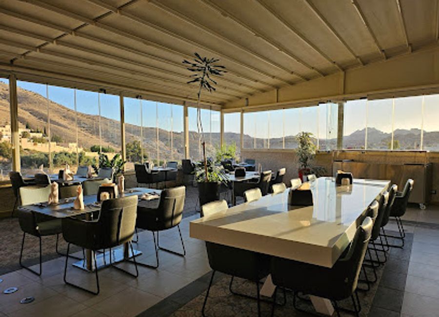 Experience exquisite dining at Petra Sky Terrace Restaurant with breathtaking views over ancient ruins in Wadi Musa.