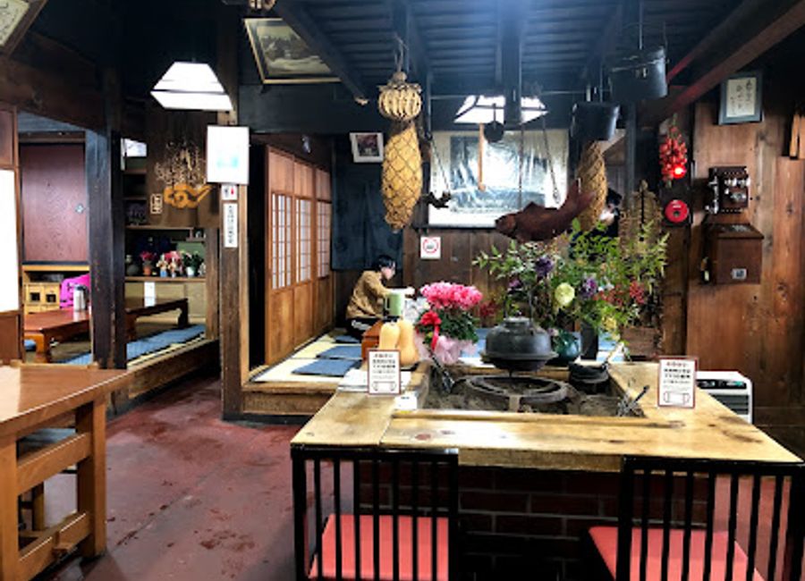 Experience authentic Japanese cuisine at Shirakawago Restaurant Irori, nestled in the scenic beauty of Shirakawa-go's heritage village.