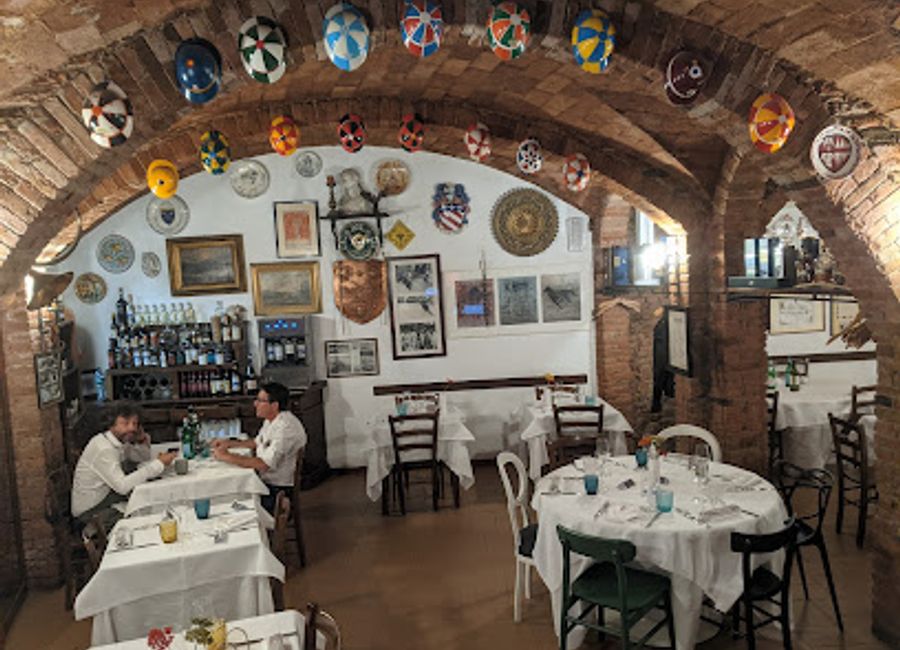 Discover authentic Italian cuisine at Grotta Santa Caterina da Bagoga in Siena - a culinary haven nestled in a serene alley.