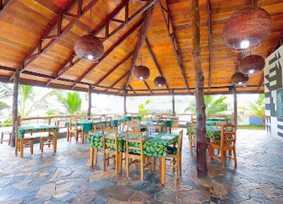 Experience exquisite dining with stunning ocean views at Lemon Beach Restaurant in Elmina, Ghana.