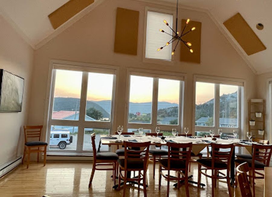 Experience the flavors of Newfoundland at The Black Spruce Restaurant in Norris Point, surrounded by the breathtaking beauty of Gros Morne National Park.