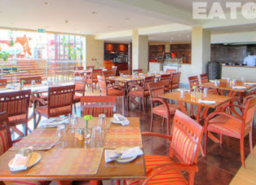 Discover exquisite Kenyan cuisine at Big Five Restaurant with stunning views of Nairobi National Park.