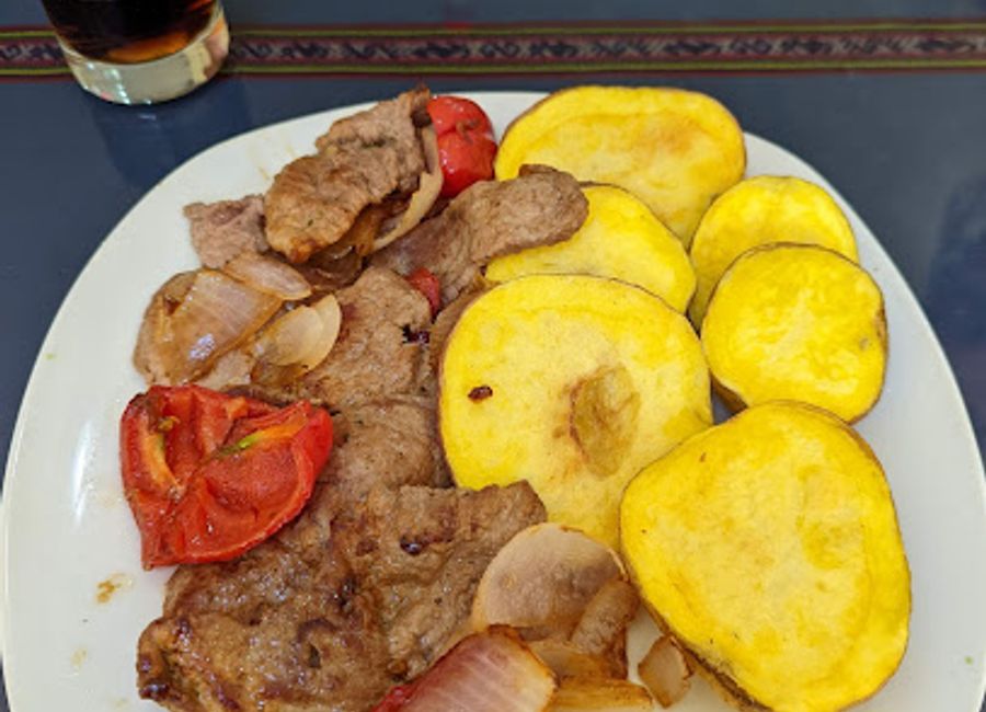 Experience authentic Peruvian cuisine amidst stunning landscapes at RestoBar International in Cabanaconde.