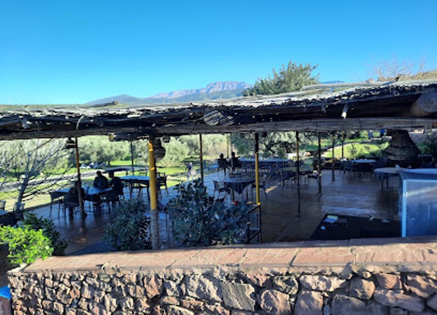 Discover La Clé Des Huiles Ourika - A serene dining experience surrounded by nature's beauty with exquisite Moroccan cuisine.