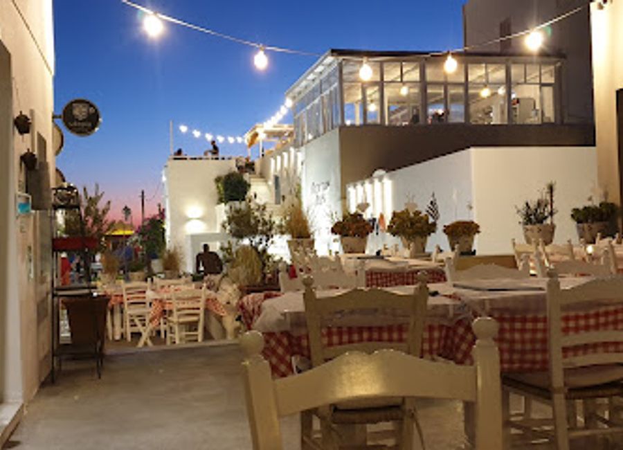 Discover authentic Greek flavors at Ouzeri in Fira, Santorini - where tradition meets breathtaking views.